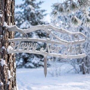 Happy New Year Stake metal yard art in raw steel finish, winter setting