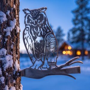 Horned Owl Stake metal yard art in raw steel finish, winter setting