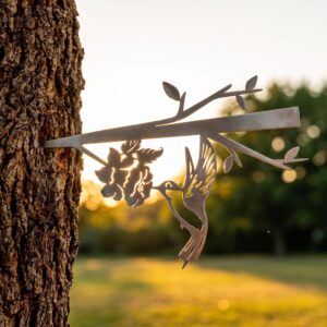 Hummingbird Stake metal yard art in raw steel finish, summer setting