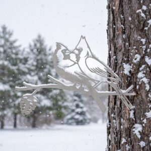 Kissing Cardinals metal yard art in raw steel finish, winter setting