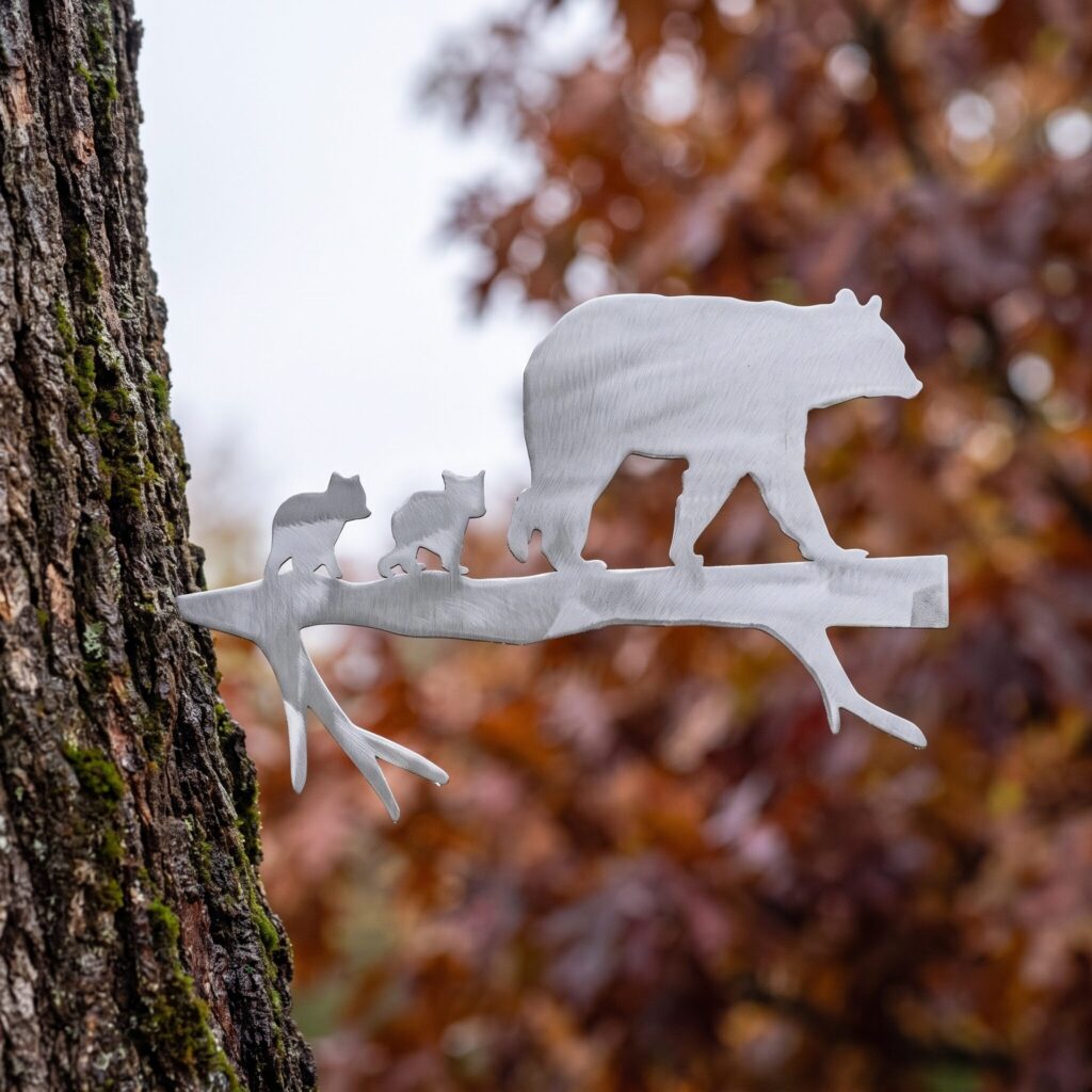 Mama Bear Stake with cubs walking a limb on an autumn tree