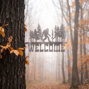 Welcome - Bigfoot metal yard art in raw steel finish, autumn setting