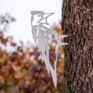 Woodpecker Stake metal yard art in raw steel finish, autumn setting